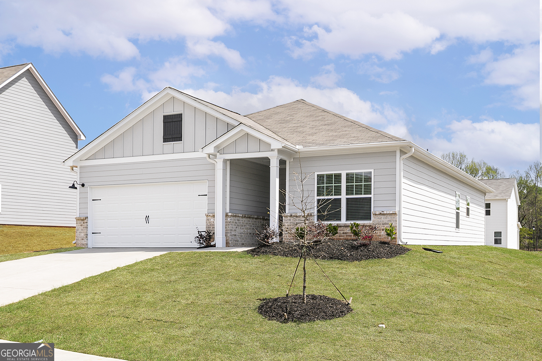 217 Darter Court Hoschton, GA 30548 - Photo 2 of 23 a backyard of a house with table and chairs