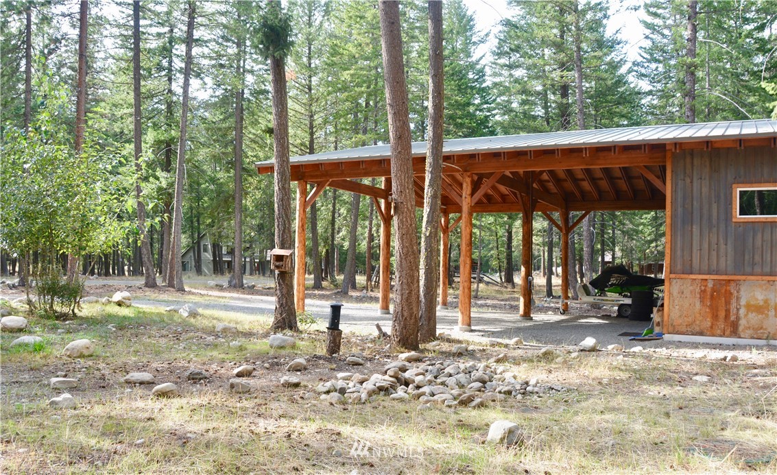 16 Littell Road Mazama, WA 98833 - Photo 16 of 21 a backyard of a house with table and chairs