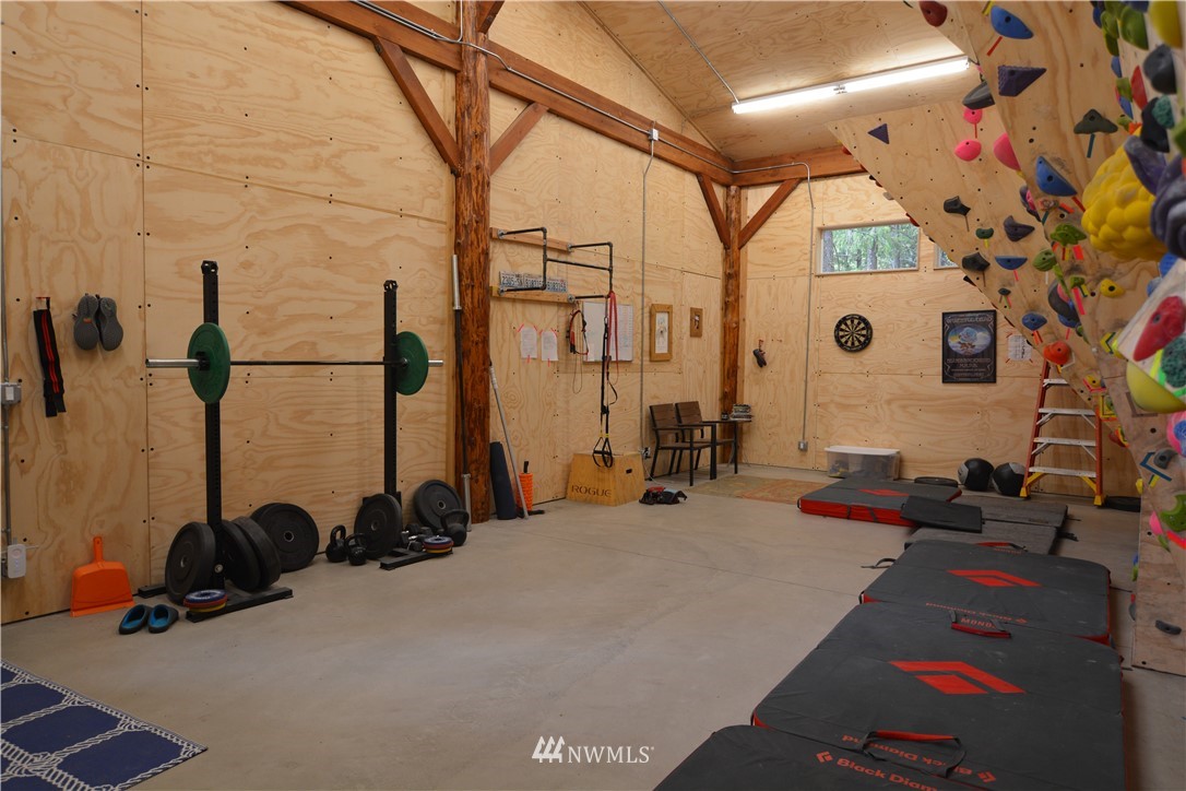 16 Littell Road Mazama, WA 98833 - Photo 17 of 21 a bed room with a bed and a large window