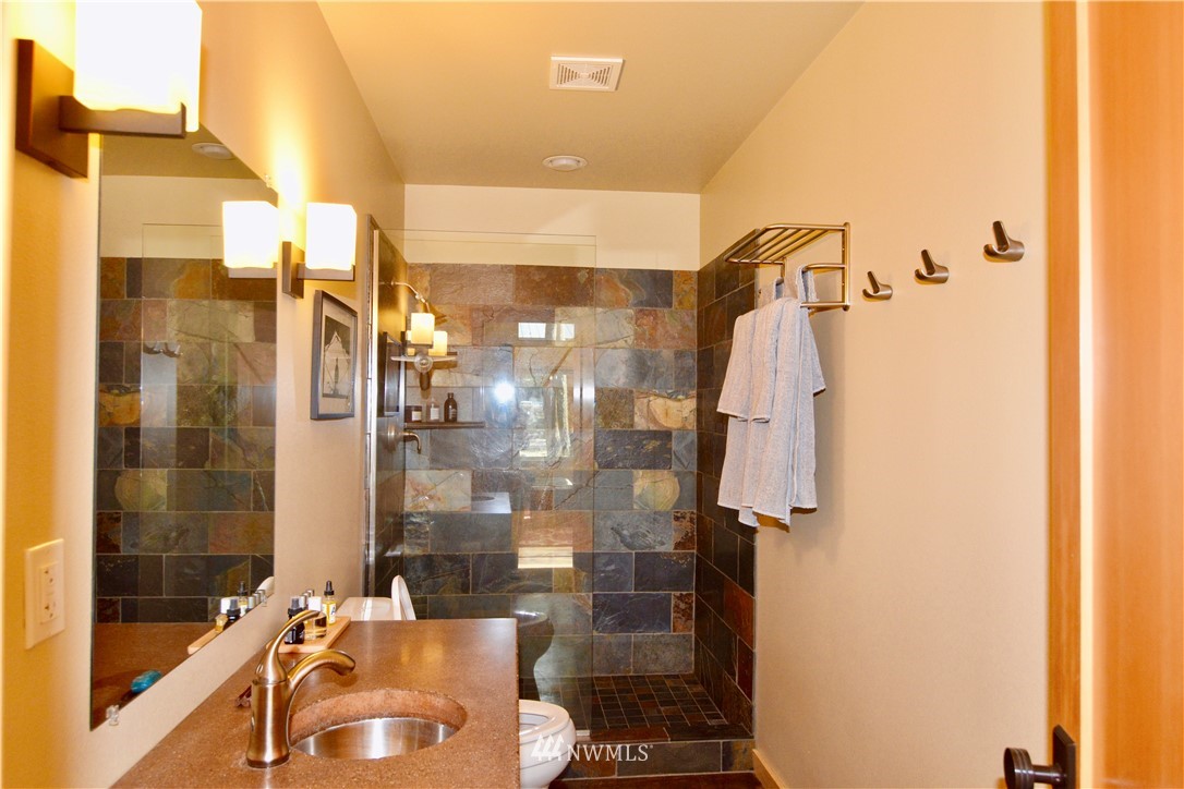 16 Littell Road Mazama, WA 98833 - Photo 8 of 21 a bathroom with a shower and a sink
