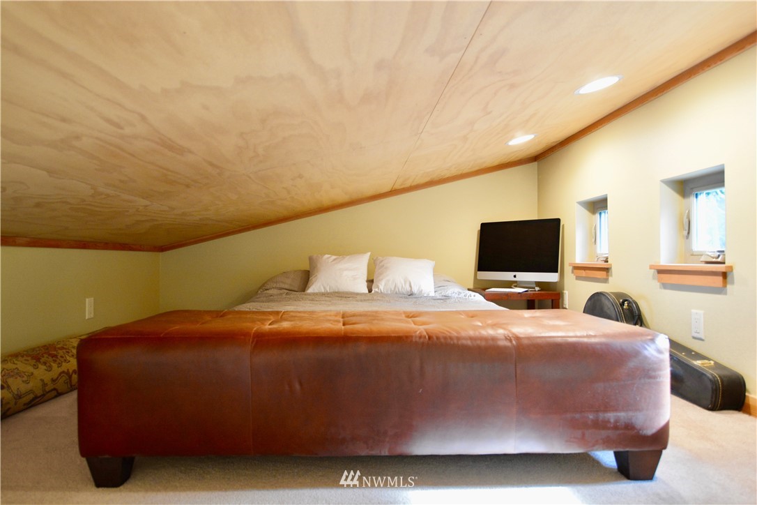 16 Littell Road Mazama, WA 98833 - Photo 10 of 21 a bedroom with a bed and a flat screen tv