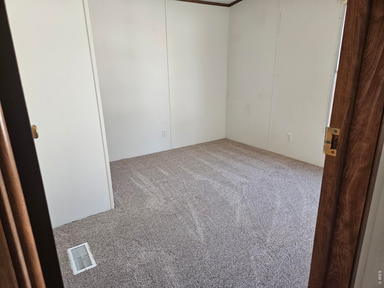 230 North 2nd Street, Unit 59 Berthoud, CO 80513 - Photo 14 of 19 an empty room with a door