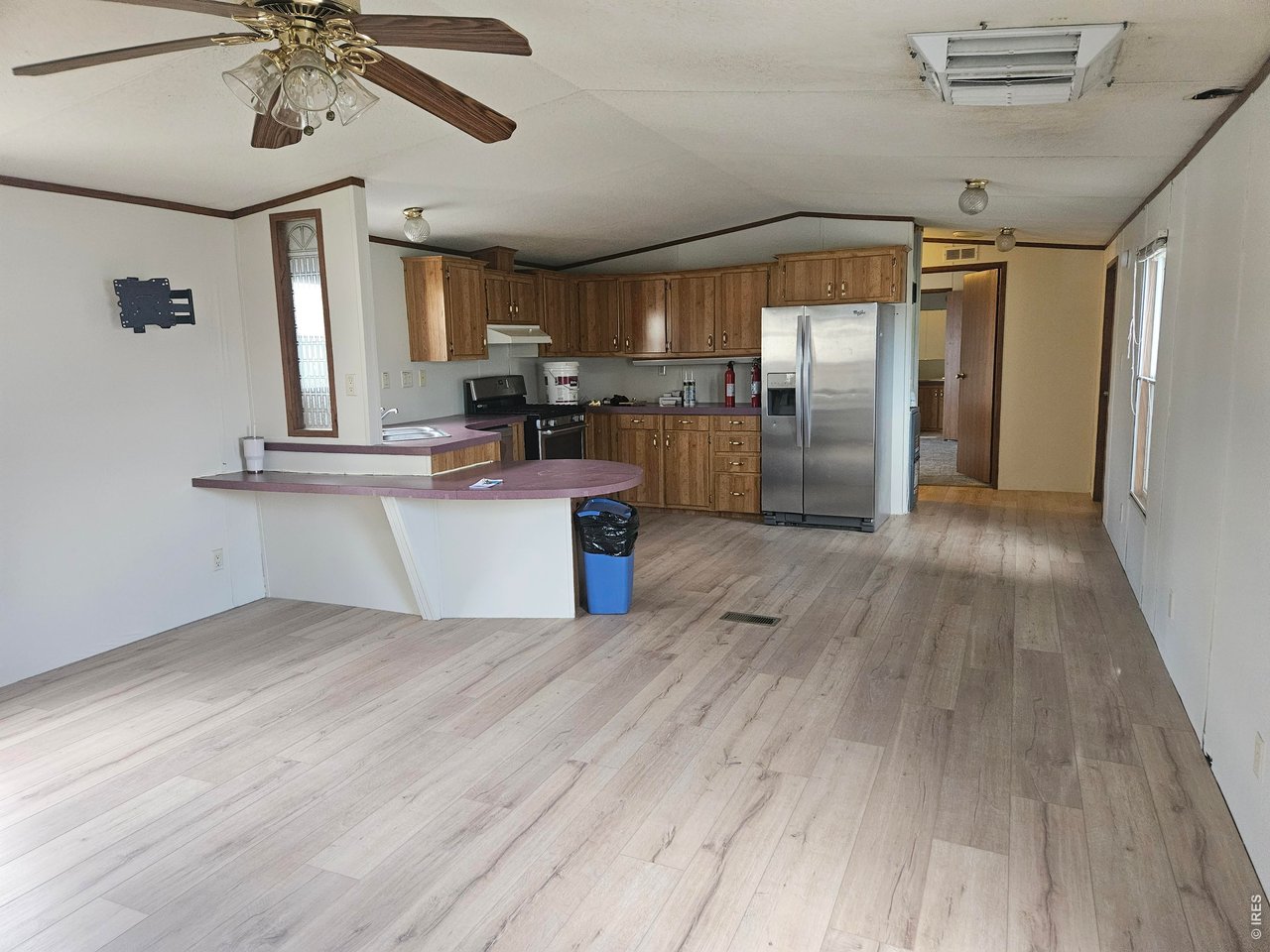 230 North 2nd Street, Unit 59 Berthoud, CO 80513 - Photo 5 of 19 a kitchen with stainless steel appliances granite countertop a refrigerator and a sink