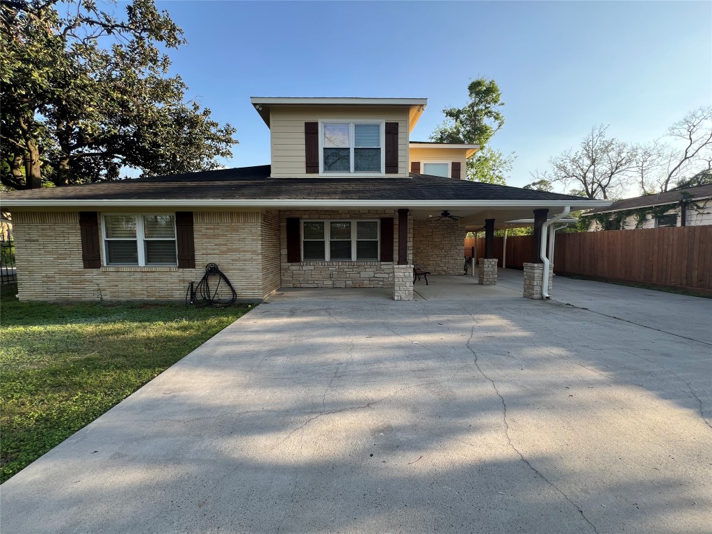 1014 Roxella Street Houston, TX 77076 - Photo 2 of 30 a view of a house with backyard and a tree