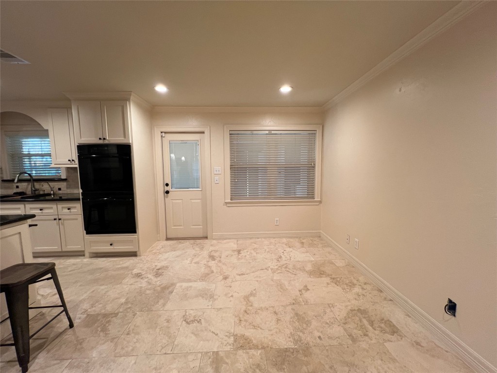 1014 Roxella Street Houston, TX 77076 - Photo 5 of 30 a view of kitchen with refrigerator and windows