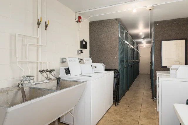 a kitchen with a sink and refrigerator