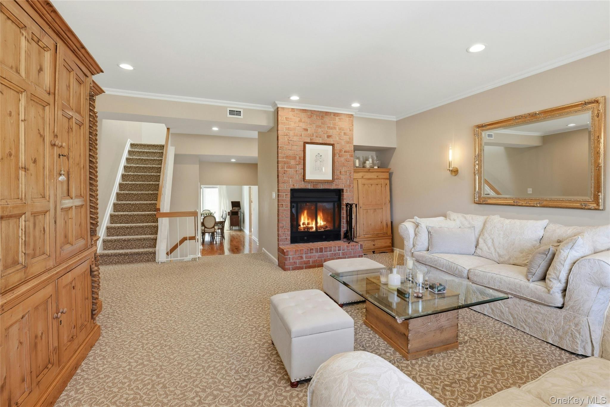 78 Hidden Ridge Drive Syosset, NY 11791 - Photo 4 of 21 a living room with furniture and a fireplace
