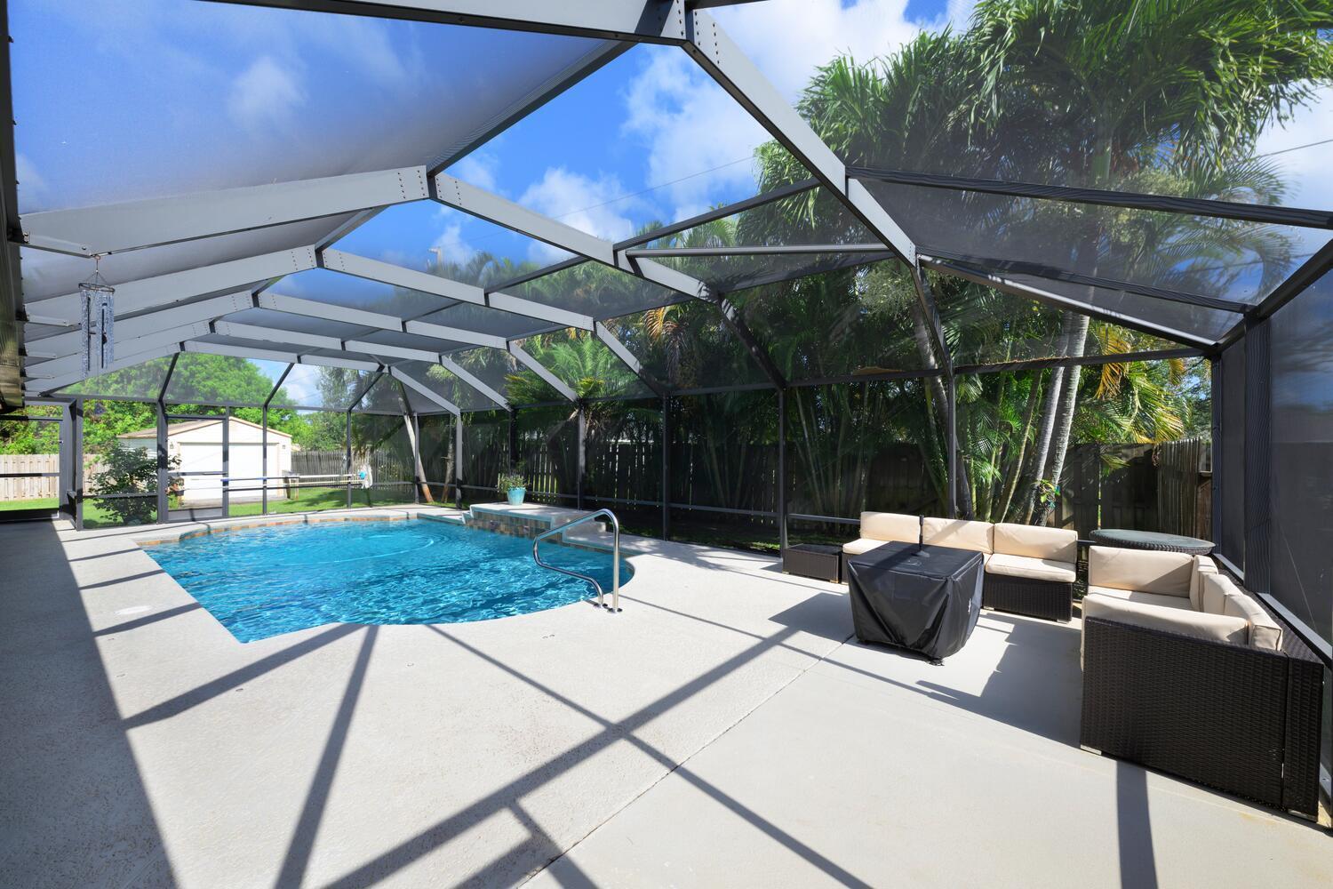 1529 Southwest Gager Road Port St. Lucie, FL 34953 - Photo 20 of 26 back patio/pool