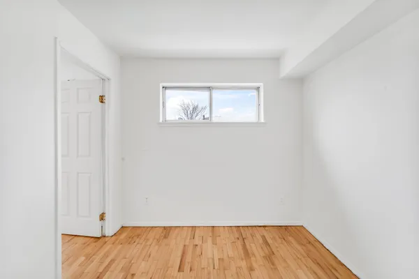 wooden floor in a white room