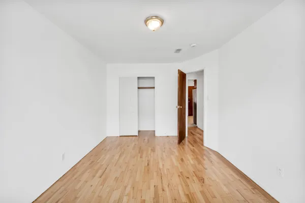 a view of hallway with wooden floor
