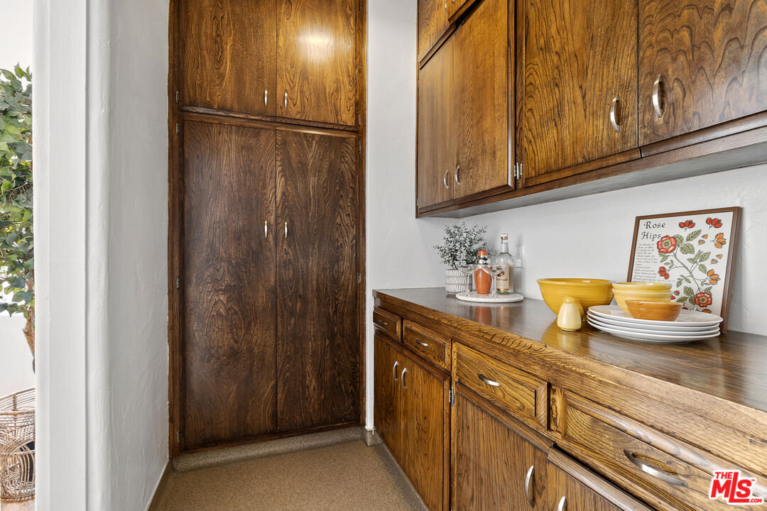 5473 Dahlia Drive Los Angeles, CA 90041 - Photo 12 of 34 a kitchen with sink refrigerator and stove