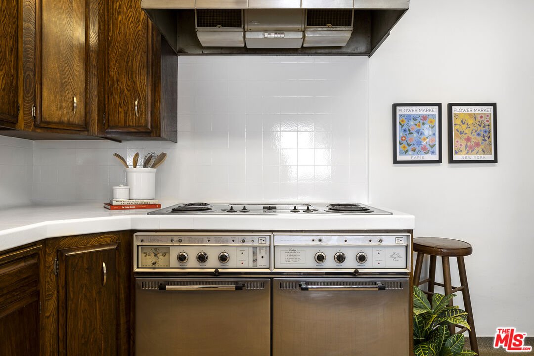 5473 Dahlia Drive Los Angeles, CA 90041 - Photo 15 of 34 a stove top oven sitting inside of a kitchen