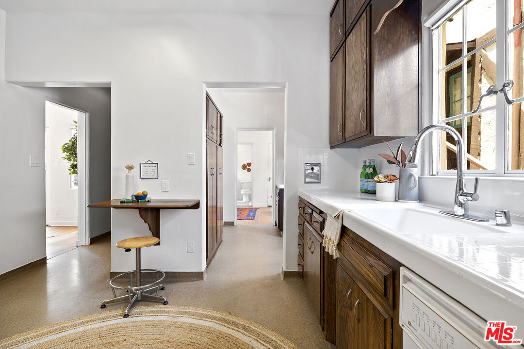 5473 Dahlia Drive Los Angeles, CA 90041 - Photo 16 of 34 a kitchen with sink and cabinets