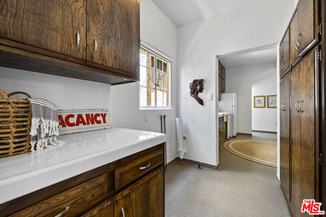 5473 Dahlia Drive Los Angeles, CA 90041 - Photo 17 of 34 a view of a kitchen with refrigerator and window