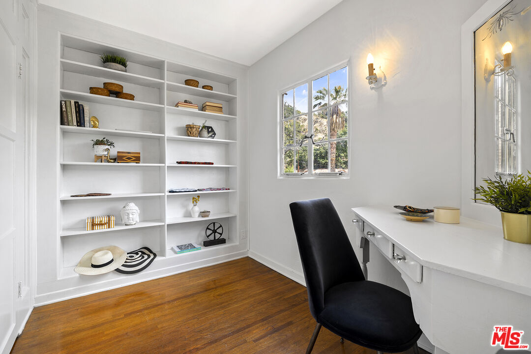 5473 Dahlia Drive Los Angeles, CA 90041 - Photo 23 of 34 a view of a workspace with furniture and wooden floor