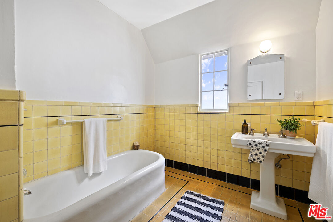 5473 Dahlia Drive Los Angeles, CA 90041 - Photo 27 of 34 a bathroom with a sink and a bathtub