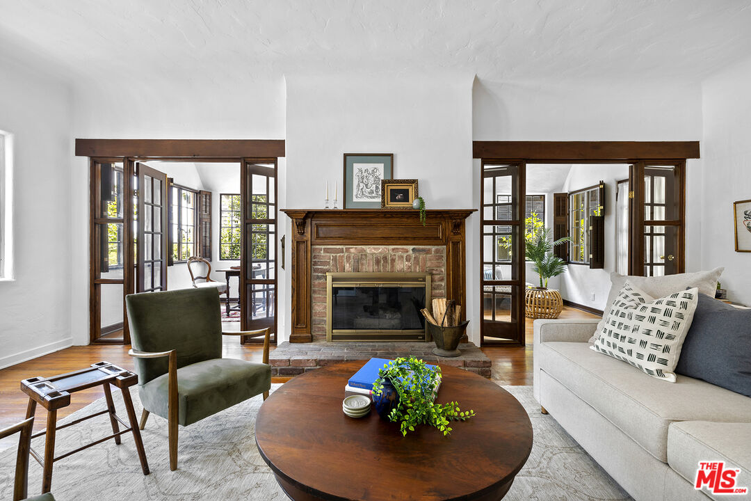 5473 Dahlia Drive Los Angeles, CA 90041 - Photo 6 of 34 a living room with furniture and a fireplace