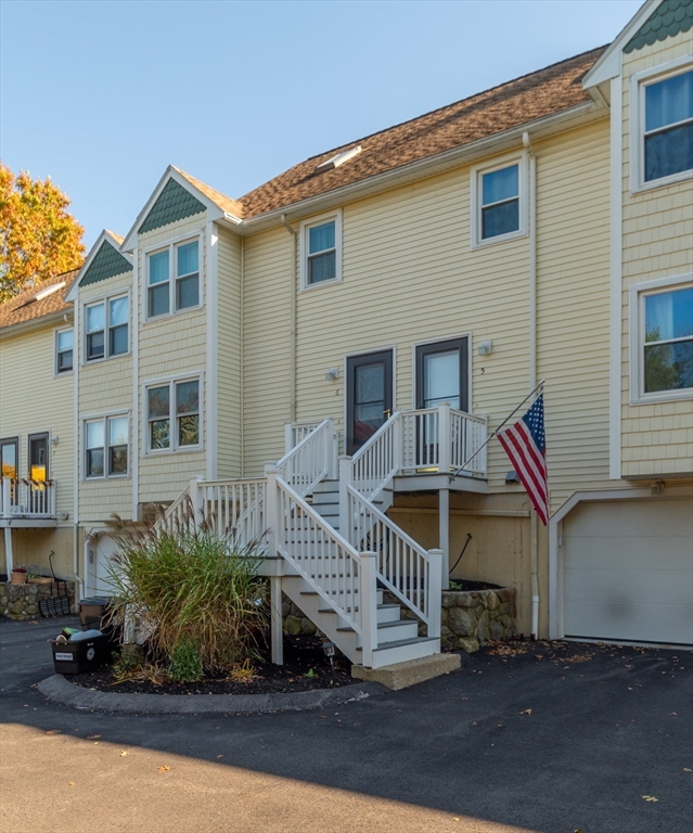 38 Kimball Avenue, Unit 5 Ipswich, MA 01938 - Photo 2 of 22 a front view of a house with entryway