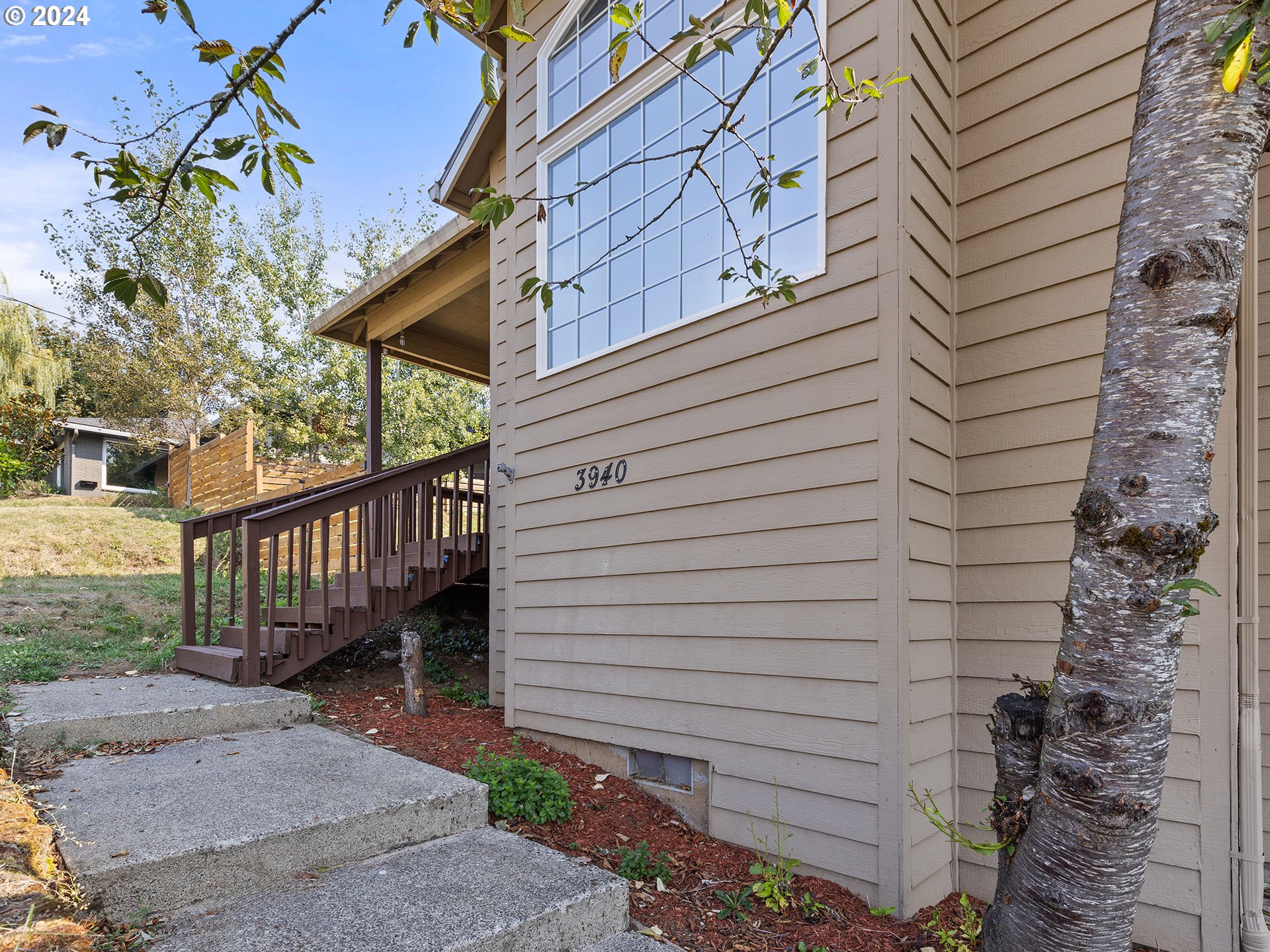3940 Northeast Franklin Street Camas, WA 98607 - Photo 14 of 21 a view of a house with wooden fence