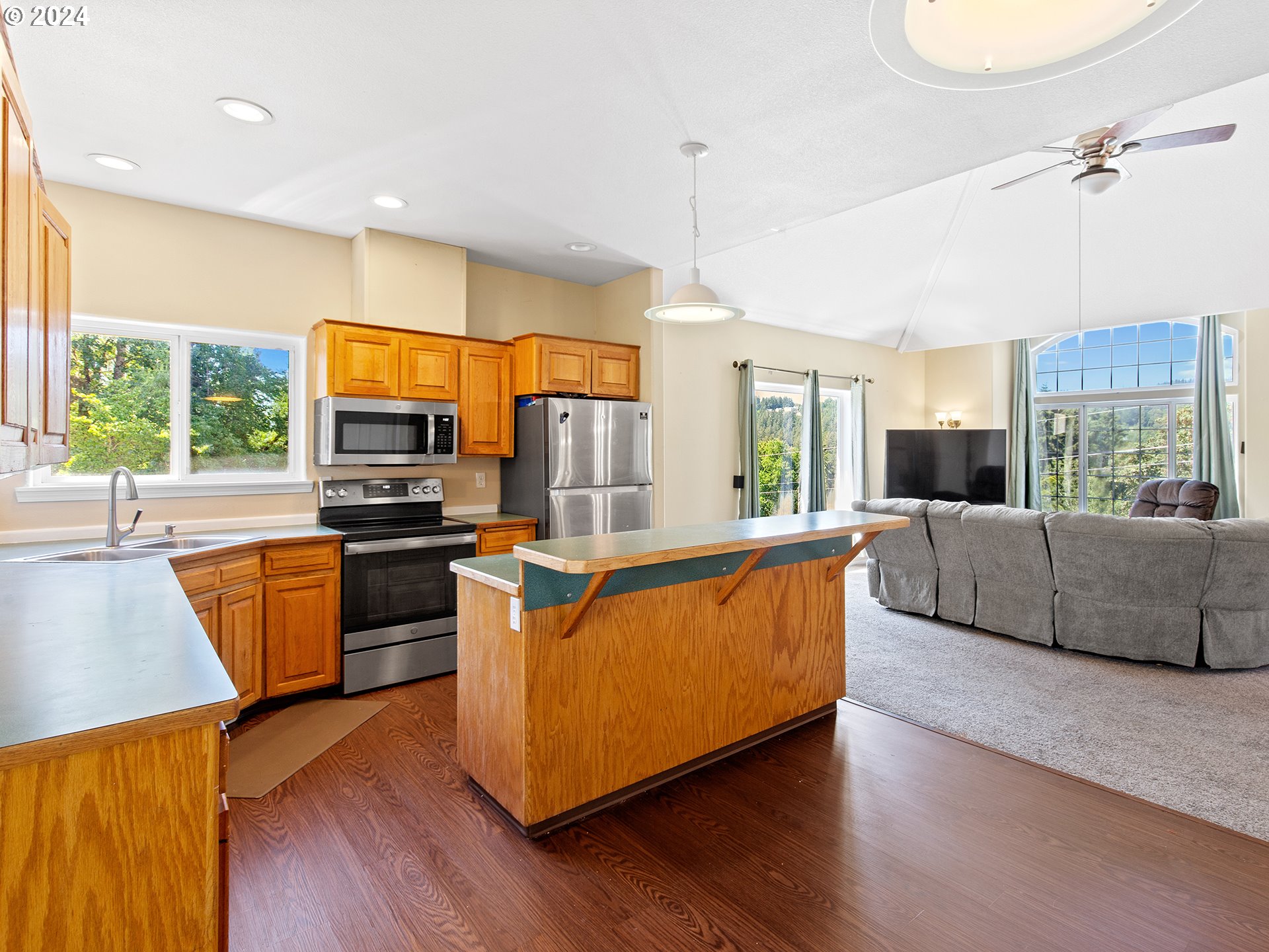 3940 Northeast Franklin Street Camas, WA 98607 - Photo 4 of 21 a living room with furniture flat screen tv and wooden floor