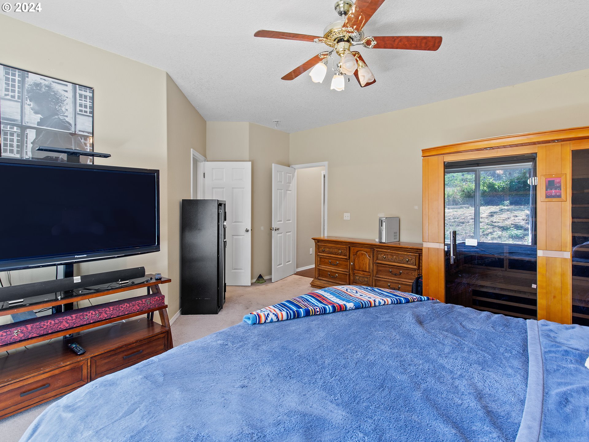 3940 Northeast Franklin Street Camas, WA 98607 - Photo 8 of 21 a bedroom with furniture and flat screen tv
