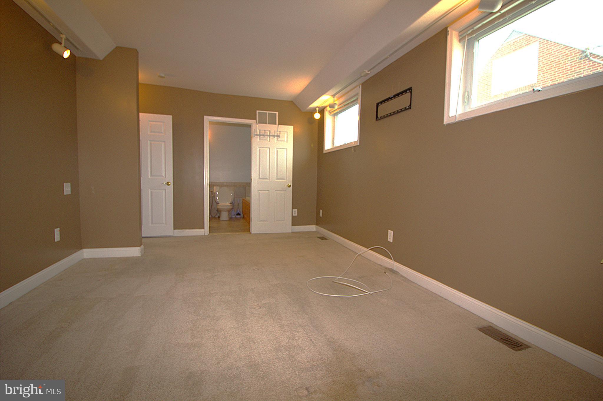 2919 Ritchie Avenue Baltimore, MD 21219 - Photo 14 of 24 a view of an empty room with a window