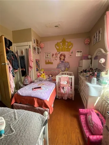 a bedroom with bed and a window