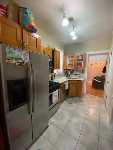 a bathroom with a granite countertop sink a mirror and a bathtub