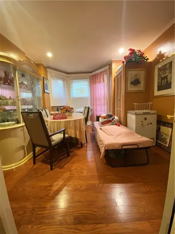 a spacious bedroom with a bed a table and chair