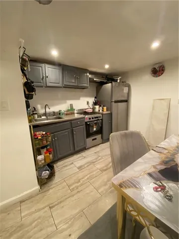 a bedroom with a bed and mirror