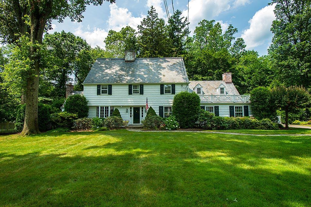 33 Birch Road Darien, CT 06820 - Photo 1 of 33 a front view of a house with a garden
