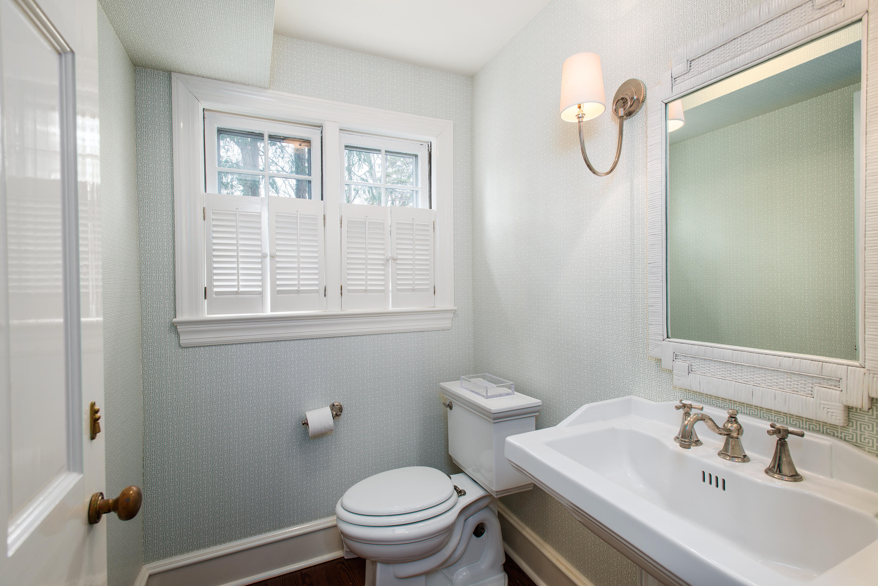 33 Birch Road Darien, CT 06820 - Photo 11 of 33 a bathroom with a sink a toilet and a window