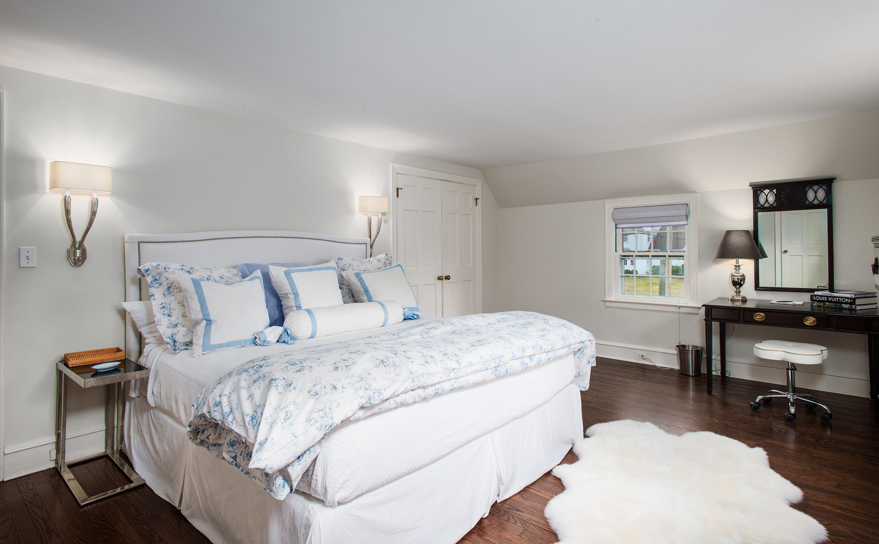 33 Birch Road Darien, CT 06820 - Photo 12 of 33 a bedroom with a bed and a table in it