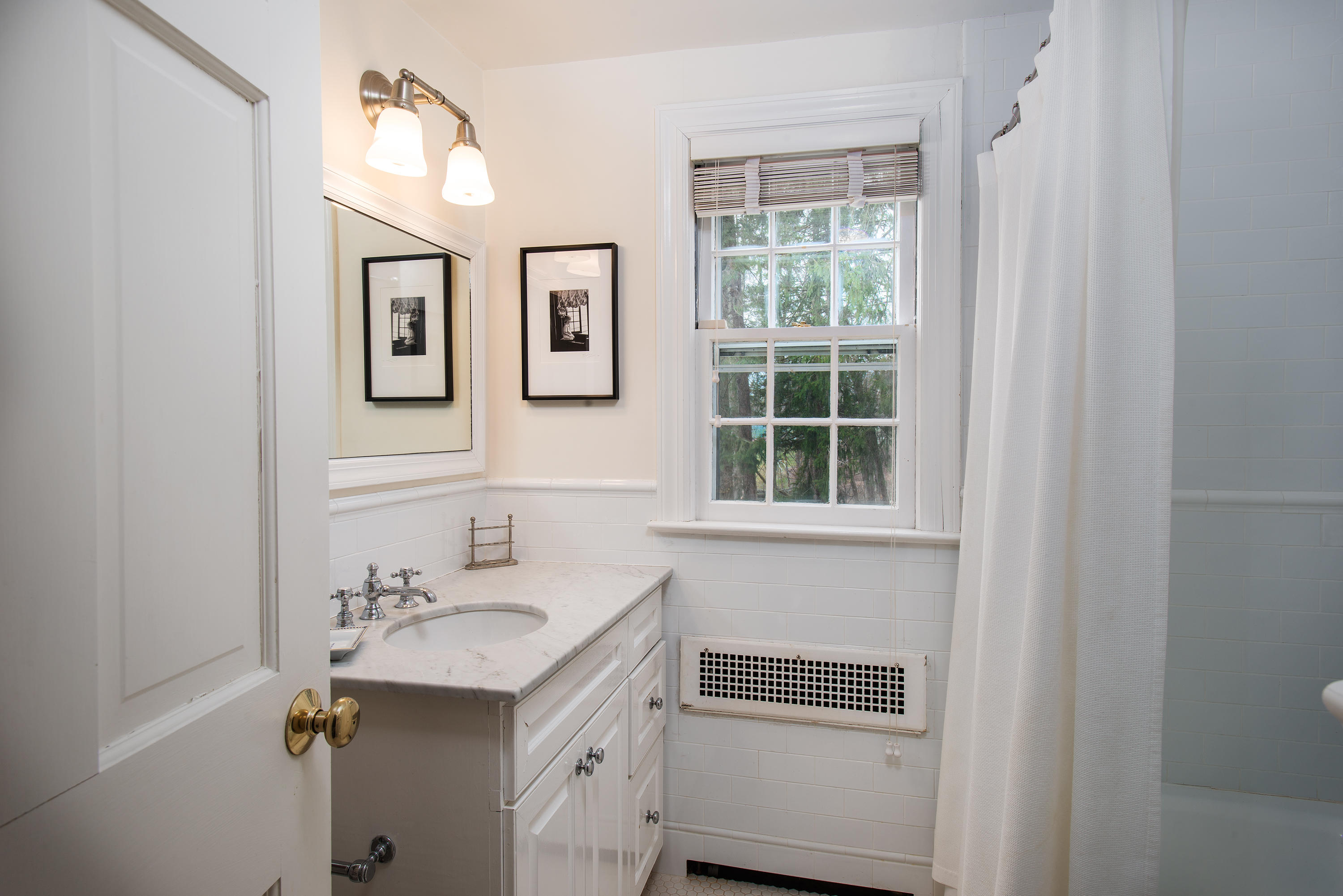 33 Birch Road Darien, CT 06820 - Photo 15 of 33 a bathroom with a sink and a mirror
