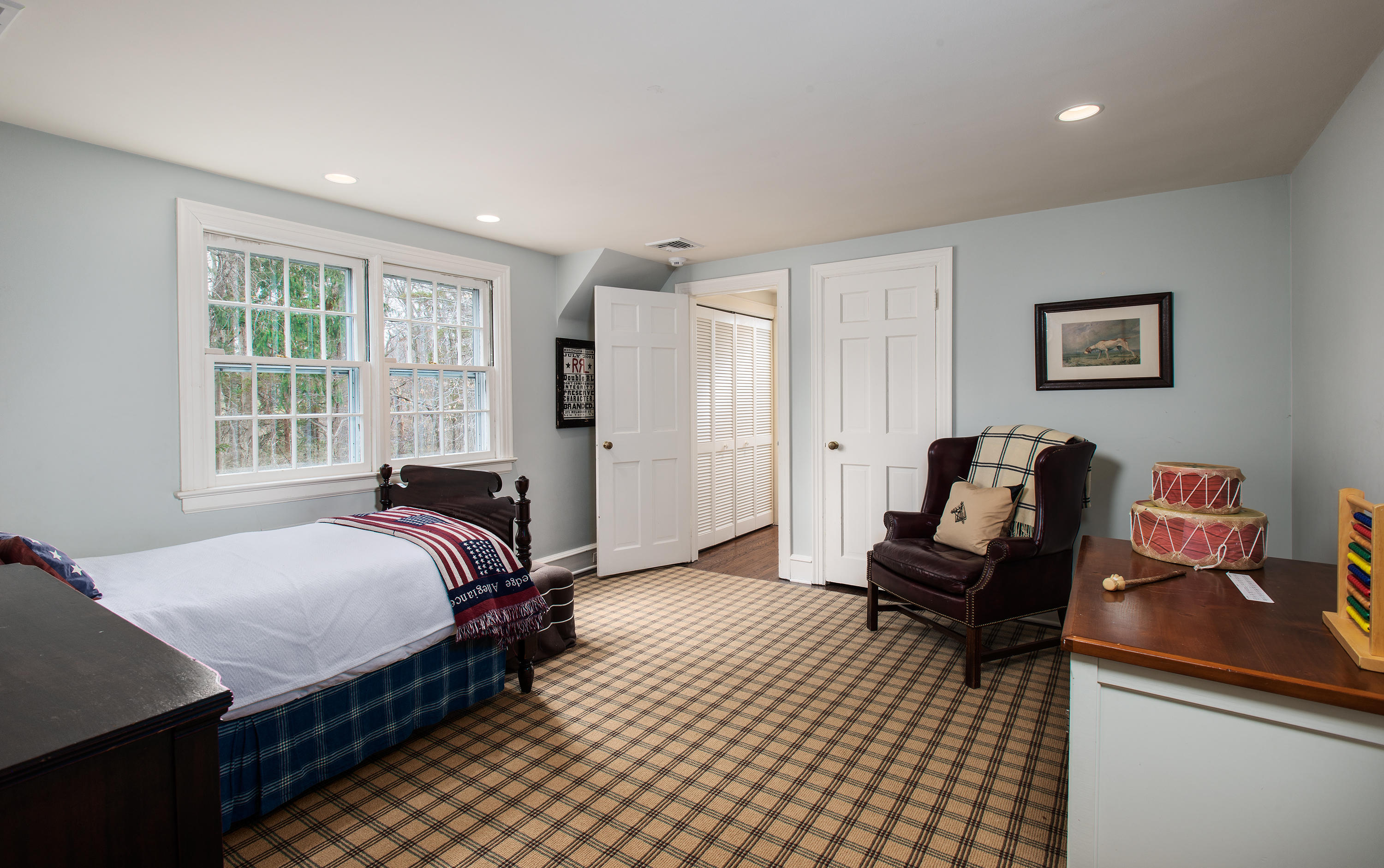 33 Birch Road Darien, CT 06820 - Photo 16 of 33 a bed room with a bed and a couch