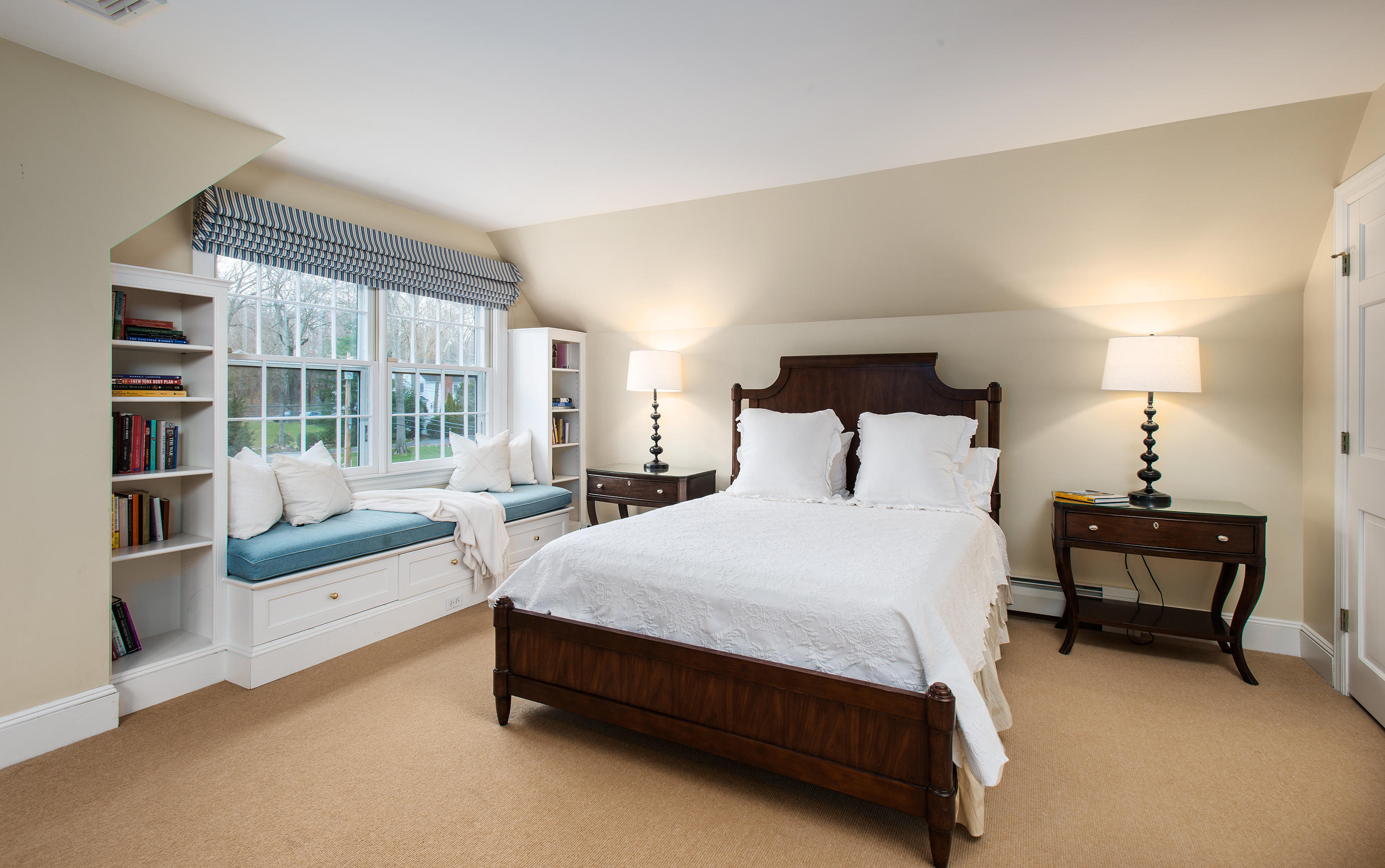 33 Birch Road Darien, CT 06820 - Photo 20 of 33 a bedroom with a bed a table and large window
