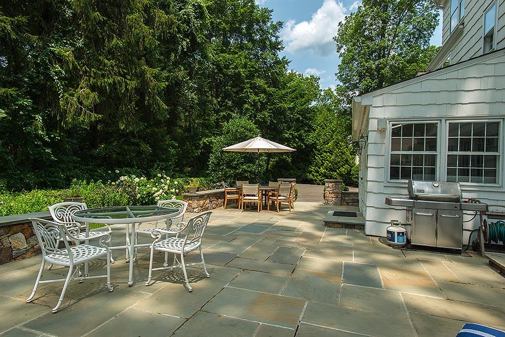 33 Birch Road Darien, CT 06820 - Photo 27 of 33 a view of a chairs and table in backyard