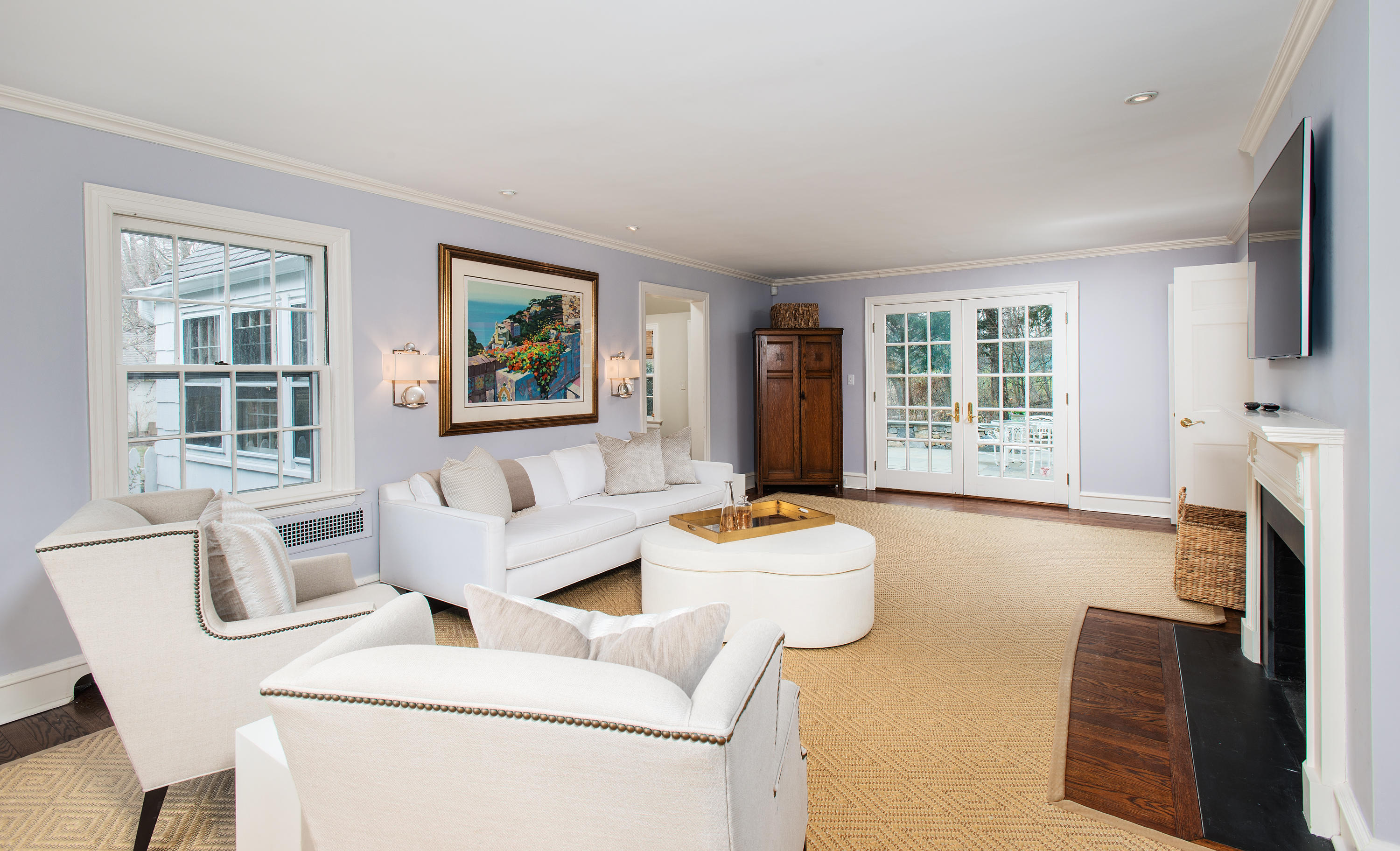 33 Birch Road Darien, CT 06820 - Photo 4 of 33 a living room with furniture a fireplace and a flat screen tv