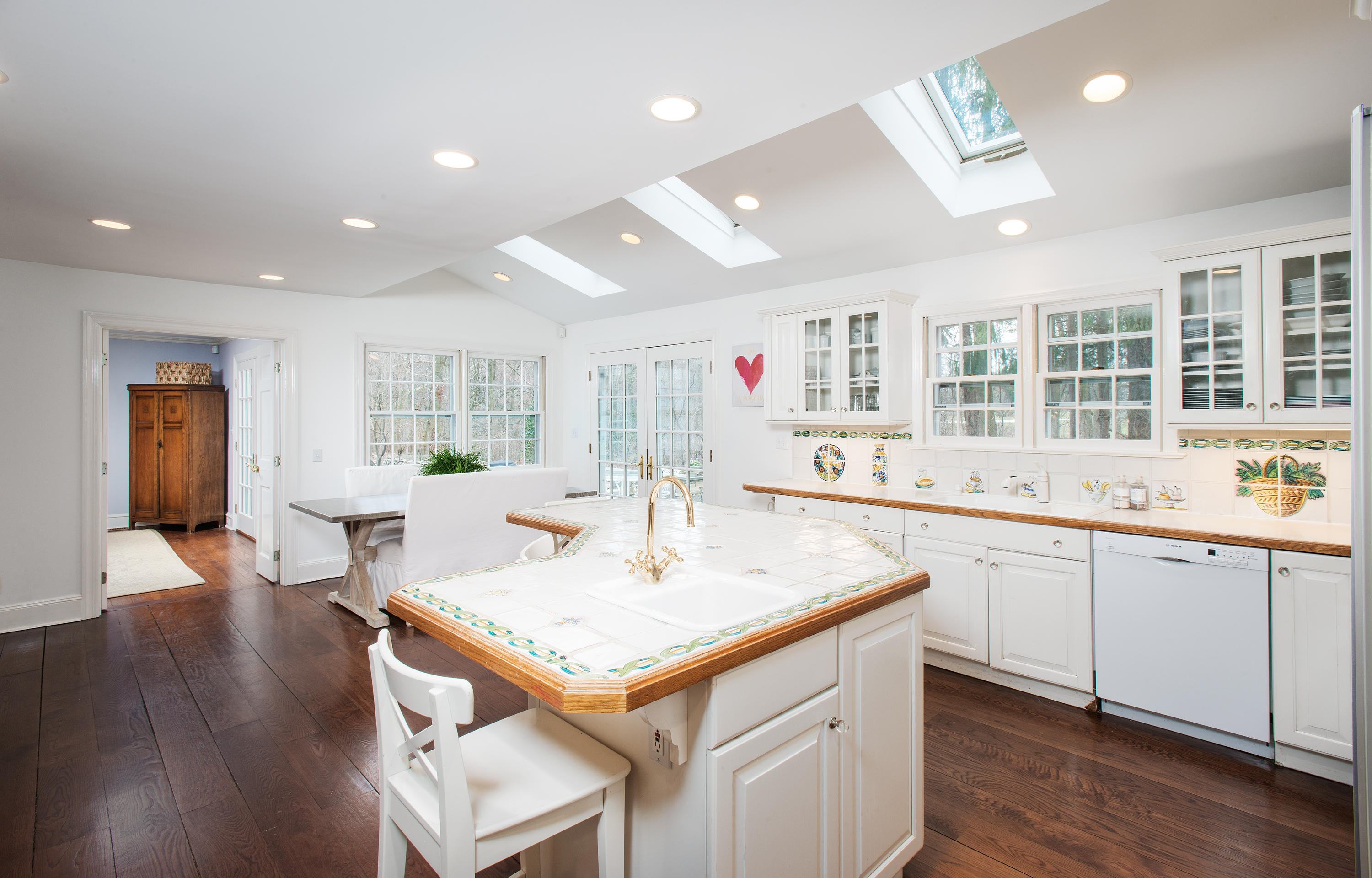 33 Birch Road Darien, CT 06820 - Photo 9 of 33 a kitchen with center island and sink