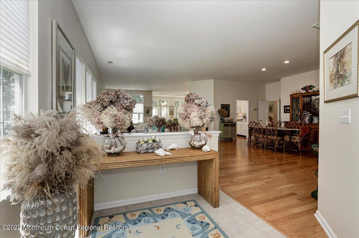 2513 Morningstar Road Manasquan, NJ 08736 - Photo 12 of 69 a living room with couches and a dining table with kitchen view