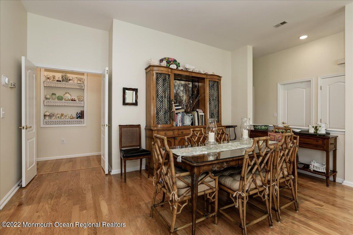 2513 Morningstar Road Manasquan, NJ 08736 - Photo 22 of 69 a view of a dining room with furniture and wooden floor