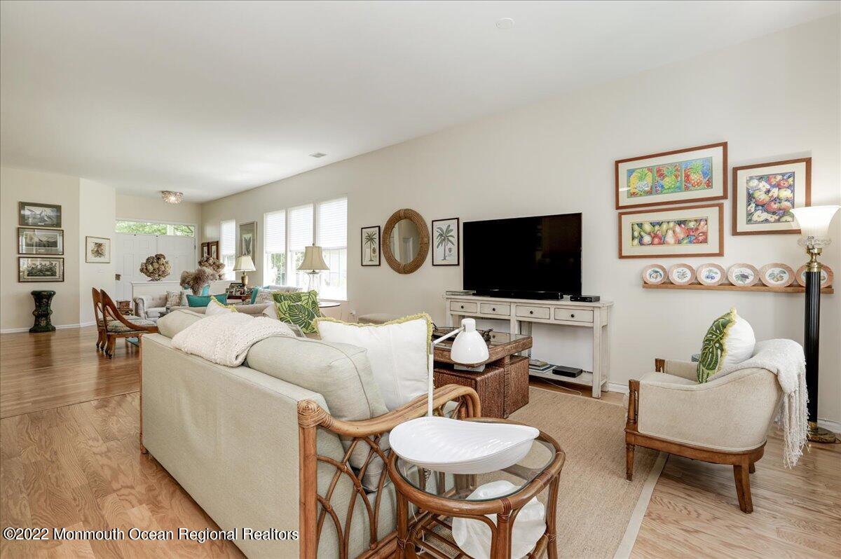 2513 Morningstar Road Manasquan, NJ 08736 - Photo 26 of 69 a living room with furniture a flat screen tv and kitchen view