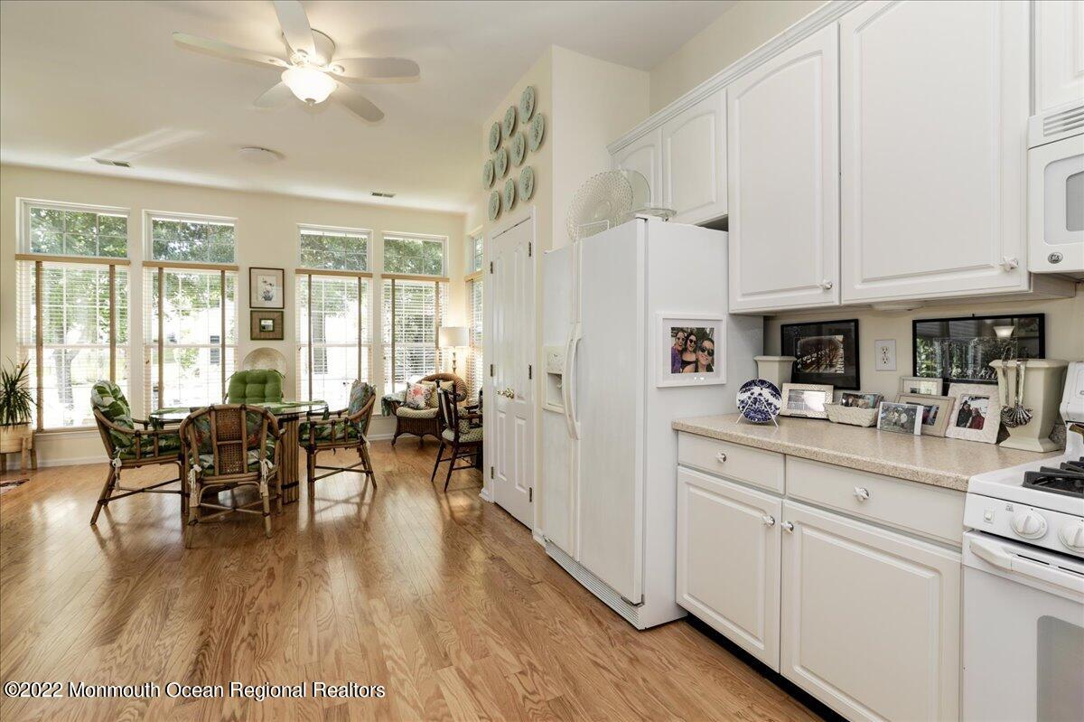 2513 Morningstar Road Manasquan, NJ 08736 - Photo 33 of 69 a view of a dining room with furniture window and wooden floor