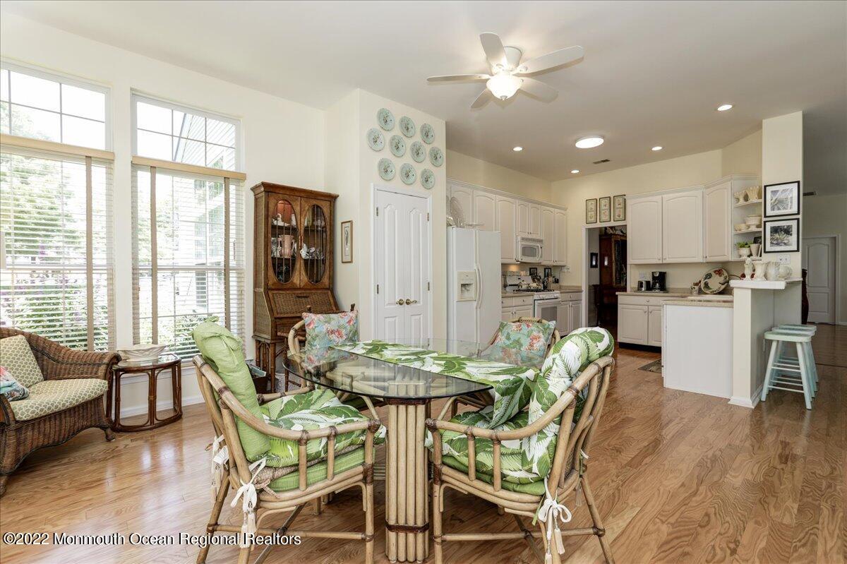 2513 Morningstar Road Manasquan, NJ 08736 - Photo 38 of 69 a view of a dining room with furniture and a chandelier
