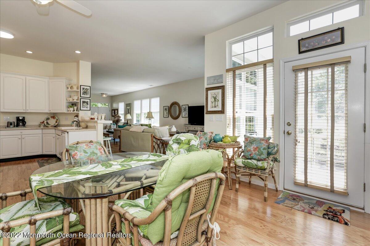 2513 Morningstar Road Manasquan, NJ 08736 - Photo 39 of 69 a view of a dining room with furniture window and wooden floor