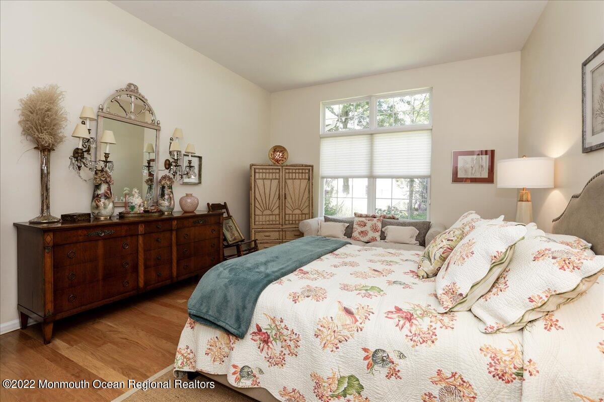 2513 Morningstar Road Manasquan, NJ 08736 - Photo 44 of 69 a bed sitting in a bedroom next to a window
