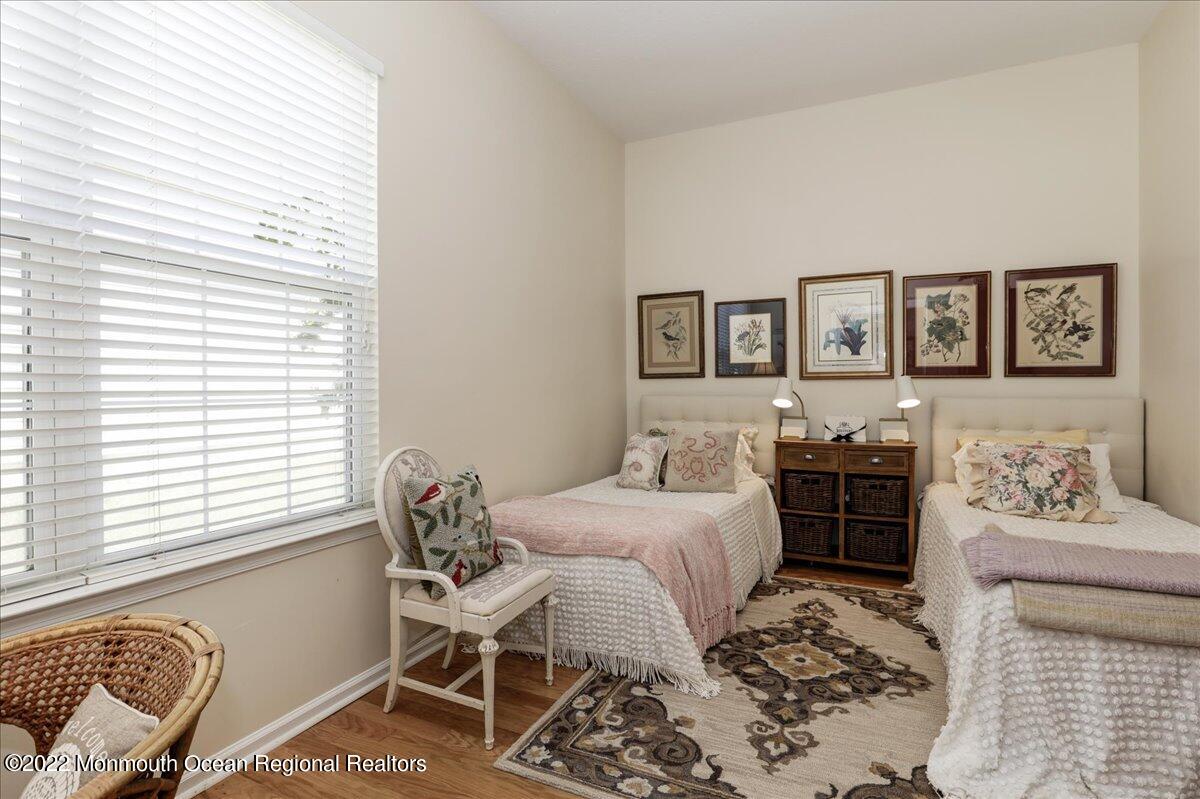 2513 Morningstar Road Manasquan, NJ 08736 - Photo 49 of 69 a bedroom with a bed and wooden floor