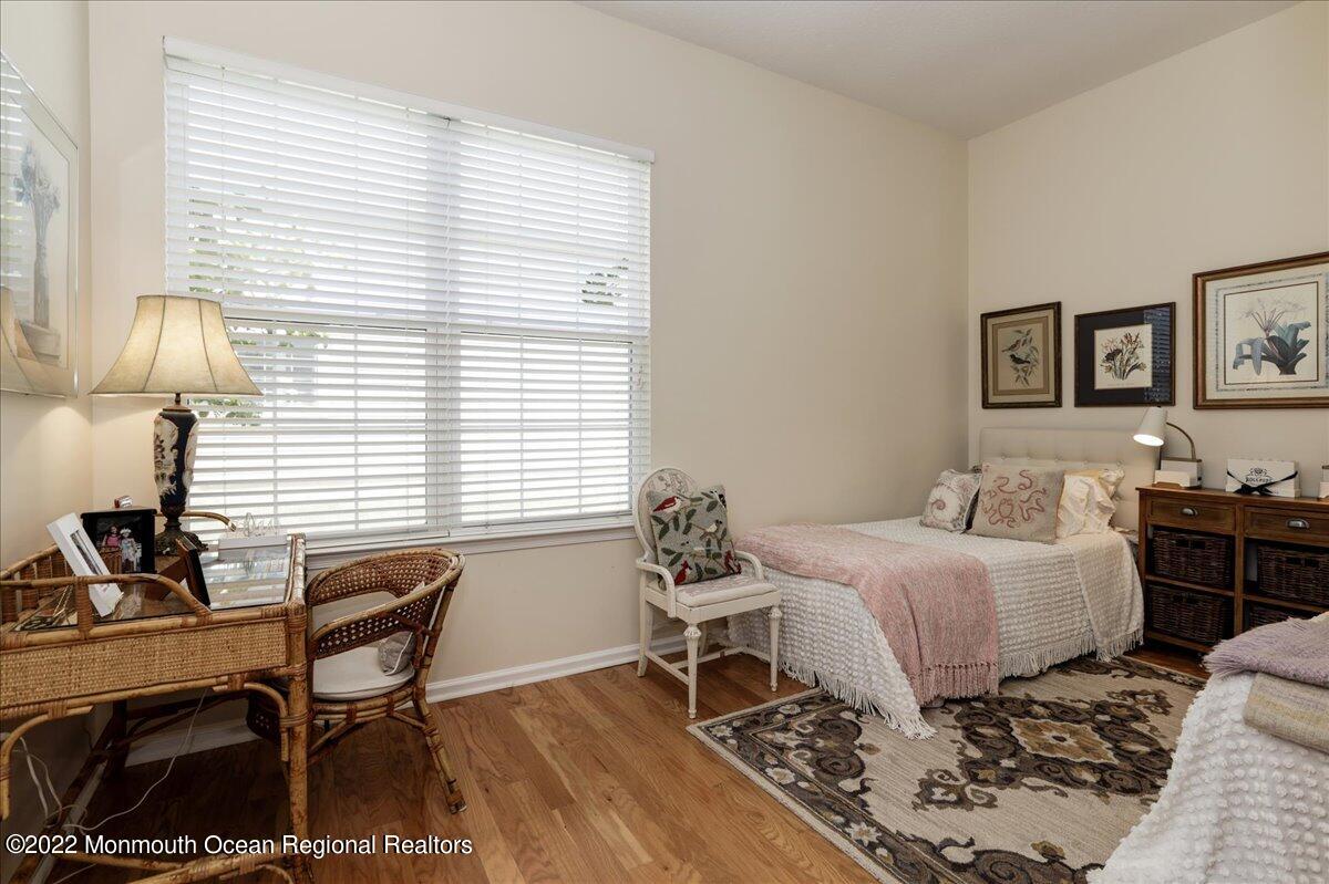 2513 Morningstar Road Manasquan, NJ 08736 - Photo 50 of 69 a bedroom with a bed and a desk