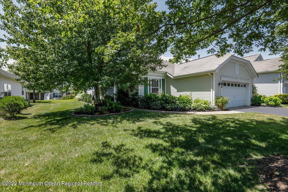 2513 Morningstar Road Manasquan, NJ 08736 - Photo 5 of 69 a front view of a house with garden