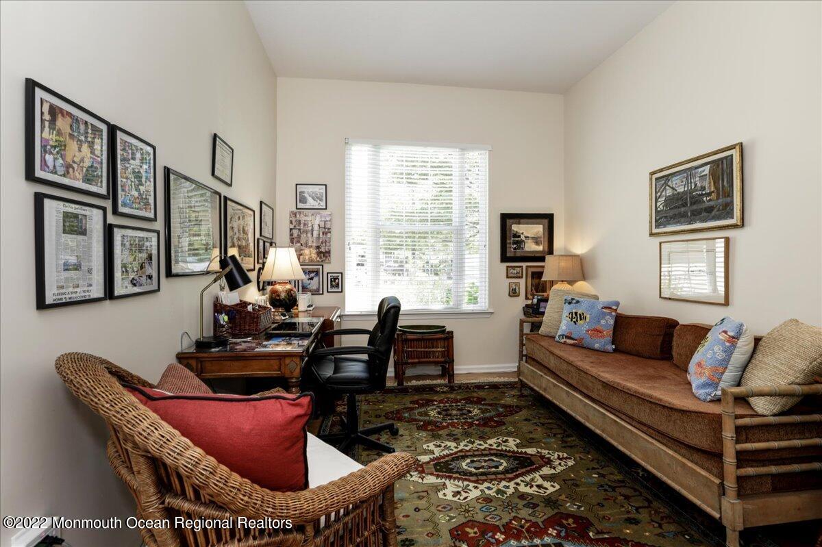 2513 Morningstar Road Manasquan, NJ 08736 - Photo 52 of 69 a living room with furniture a rug and a window